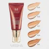 A Missha M Perfect Cover BB Cream tube with swatches of different shades displayed next to it. Podgląd zdjęcia produktu
