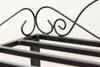 Close-up of the top part of a black metal shoe rack with decorative scrollwork. Produktbild-Vorschau