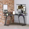 A gaming desk setup in a room with a brick wall. Voir les images du produit