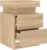 A product shot of a wooden nightstand with three drawers, two of which are partially open. Náhled obrázku produktu