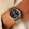 A close-up shot of a man's wrist wearing a Citizen Eco-Drive chronograph watch. Podgląd zdjęcia produktu