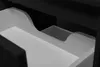 A close-up view of the interior of a black cabinet drawer, showing a white insert with a curved divider. Anteprima dell’immagine prodotto