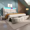 A modern bedroom with a large bed featuring LED lighting and storage drawers. Podgląd zdjęcia produktu