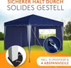 A blue pop-up tent set up on a grassy lawn with a bright sky in the background. Produktbild-Vorschau