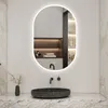 A modern bathroom vanity with a sink and a backlit oval mirror. Produktbild-Vorschau