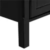 A close-up view of the bottom corner of a black furniture item, showing one of its legs. Produktbild-Vorschau