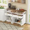 A kitchen sideboard filled with various food items and appliances, set up as a coffee bar. Produktbild-Vorschau