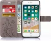 A grey flip case for an iPhone 6 is shown open, displaying cards and euro banknotes inside, with the phone screen visible. Produktbild-Vorschau