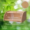 A wooden bread box is shown against a blurred green leafy background, with text and a circular wood sample overlay. Produktbild-Vorschau