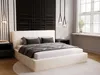 A bedroom scene with a bed, nightstands, and decorative wall art. Náhled obrázku produktu