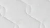 A close-up texture shot of a white mattress fabric with a subtle green aloe vera pattern. Náhľad obrázku produktu