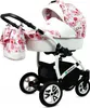 A baby stroller with a floral pattern and a matching bag. Produktbild-Vorschau