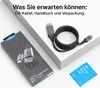 A product box, a coiled cable, and a small booklet are arranged on a light gray surface. Produktbild-Vorschau