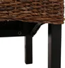A close-up view of the bottom part of a woven basket chair or stool, showing the dark wooden legs and the woven texture. Produktbild-Vorschau