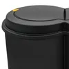 Close-up of the lid of a black trash can with a yellow button. Voir les images du produit