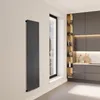 A modern kitchen with dark gray cabinets and a tall, black vertical radiator on a light-colored wall next to a window. Produktbild-Vorschau