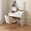 A white vanity table with a mirror and a beige chair in a room. Náhľad obrázku produktu