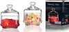 Three glass jars with lids, two filled with contents and one on a product box. Náhled obrázku produktu