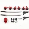 A collection of action figure accessories laid out on a light gray surface. Podgląd zdjęcia produktu