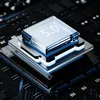 A close-up view of a microchip with '5.0' printed on it, set against a dark, futuristic background with blue accents. Náhled obrázku produktu