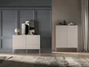 A modern living room with two sideboards, one with drawers and one with doors, decorated with artwork and vases. Produktbild-Vorschau