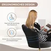 A woman is sitting in a black office chair and reading a magazine. The chair has an ergonomic design with a flower-shaped backrest. Voir les images du produit