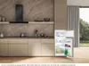 A modern kitchen scene with a Bauknecht built-in refrigerator-freezer combination unit. Produktbild-Vorschau