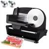 A black meat slicer with a large silver blade sits on a white surface, with cuts of raw meat and rosemary on a wooden board in the foreground. Two extra blades are shown in the top left corner. Produktbild-Vorschau