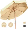 A beige patio umbrella with a wooden pole and frame, shown from a low angle. Náhled obrázku produktu