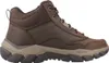 A side view of a brown and black men's boot against a white background. Voir les images du produit