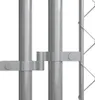 A close-up view of metal poles and connectors for an outdoor dog kennel. Voir les images du produit