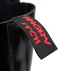 A close-up of a black boot with a red tag that says "ANGRY ITCH". Náhľad obrázku produktu
