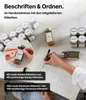 A person is shown labeling spice jars with stickers, with several jars arranged on a table. Anteprima dell’immagine prodotto