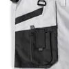 A close-up view of the pocket area of a pair of work pants. Produktbild-Vorschau