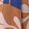 A close-up view of a folded fabric with a patterned design. Produktbild-Vorschau