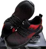 A pair of black and red safety shoes are displayed on a cardboard box. Produktbild-Vorschau