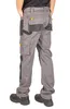 A person wearing work pants from the back. Náhled obrázku produktu