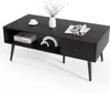 A black coffee table with a drawer and open shelf, displayed on a white background. Produktbild-Vorschau