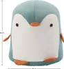 A studio shot of a plush penguin-shaped stool. Produktbild-Vorschau