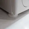 Close-up of the bottom corner of a white appliance, showing a rubber anti-vibration pad on the floor. Náhľad obrázku produktu