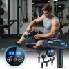 A man is using a massage gun on his leg in a gym setting. There are multiple massage heads shown. Produktbild-Vorschau
