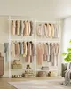 A well-organized wardrobe rack with various clothing items and accessories displayed on shelves. Produktbild-Vorschau