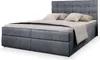 A studio shot of a gray upholstered boxspring bed with a headboard and pillows. Produktbild-Vorschau