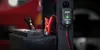 A car battery is being charged by a NOCO Genius smart charger. Podgląd zdjęcia produktu