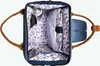 An open backpack showing its interior compartments and contents. Voir les images du produit