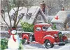 A snowy winter scene with a red vintage truck, a snowman, and houses in the background. Produktbild-Vorschau