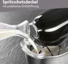 Milk being poured into a kitchen appliance through a splash guard opening. Produktbild-Vorschau