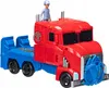 A toy Optimus Prime truck with a small figure on top, isolated on a white background. Podgląd zdjęcia produktu