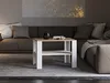 A coffee table is placed in front of a sofa in a living room setting. Náhled obrázku produktu