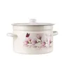 A cream-colored enamel pot with a lid, decorated with pink magnolia flowers and a butterfly. The word "Magnolia" is written on the side. Produktbild-Vorschau